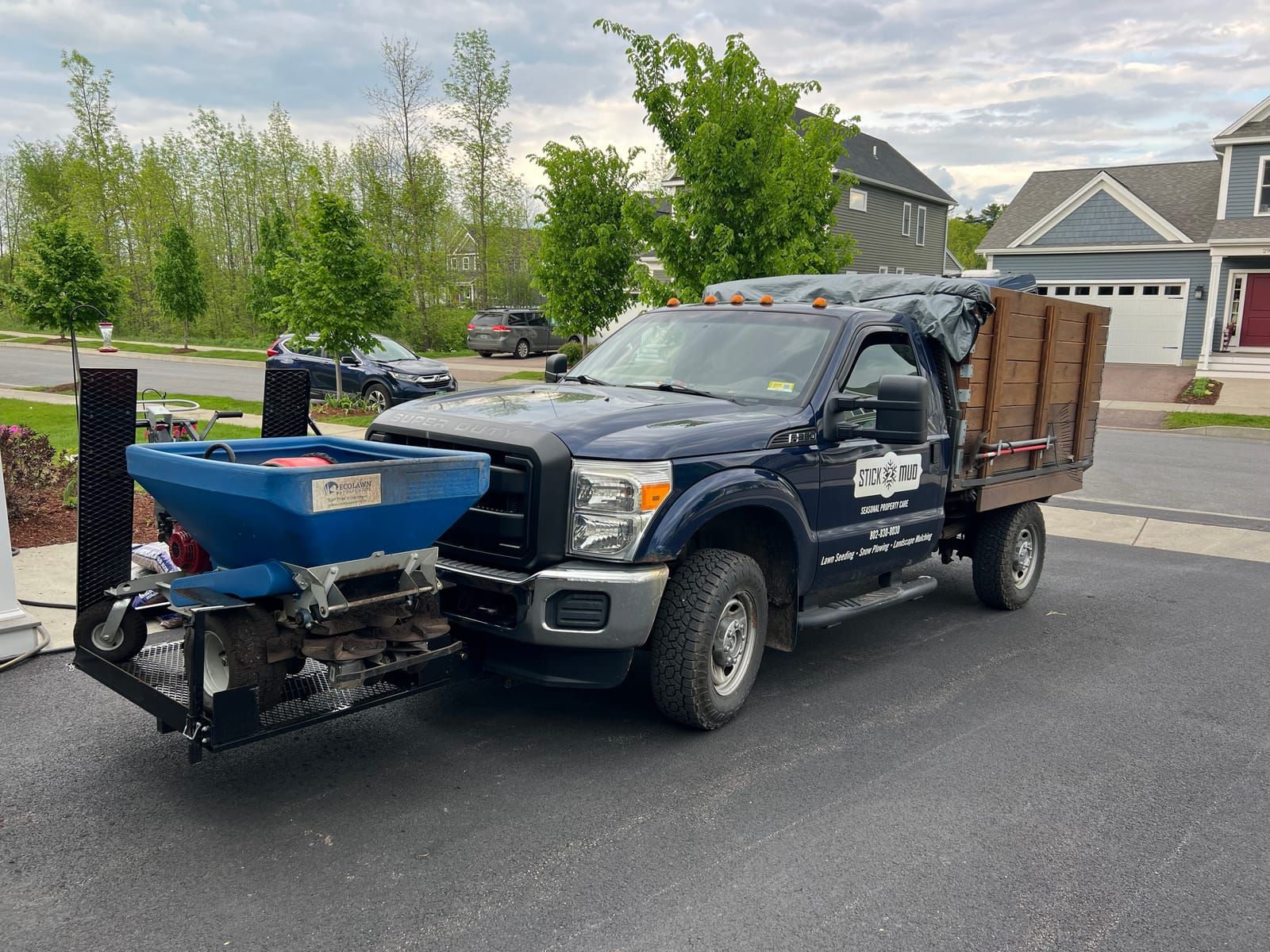 The Stick2Mud truck with a topdresser mounted on the hitch