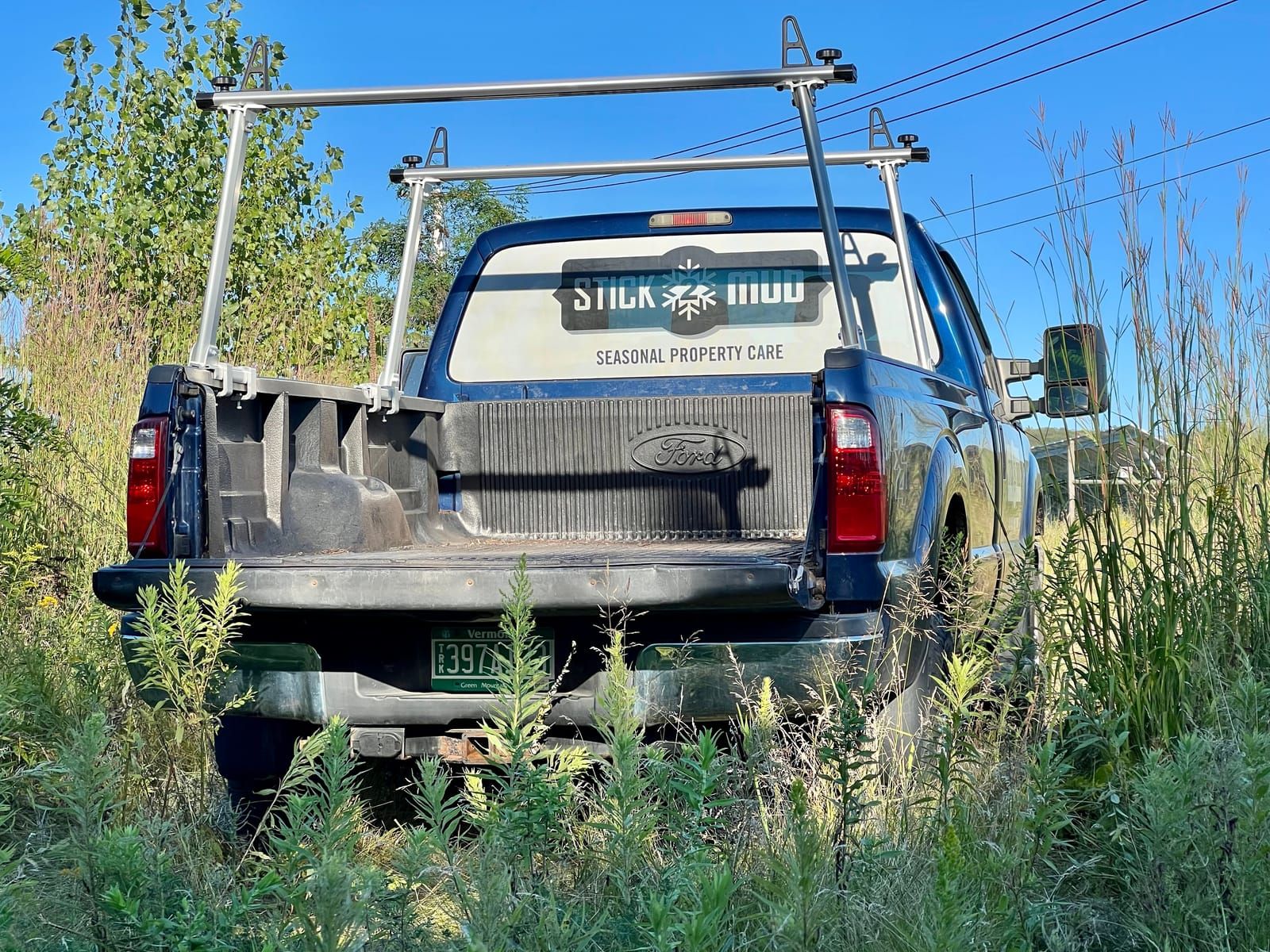 The Stick2Mud logo on the truck's tailgate